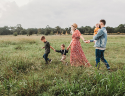 Family in Field Happy Family Together Outside